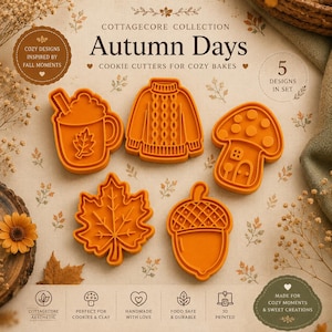Può includere: Un set di cinque tagliabiscotti arancioni con forme a tema autunnale, tra cui una tazza con una foglia, un maglione a trecce, una casa a fungo, una foglia d'acero e una ghianda. Il testo recita COTTAGECORE COLLECTION Autumn Days.
