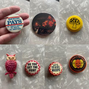 May include: A collection of ten vintage button pins. The pins feature various designs, including a mushroom, a pink owl, a wrestler, and text-based slogans like "Smoking Pays" and "Let's Make Whoopie".
