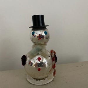vintage glass snowman ornament with paper base Japan