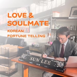 May include: A black desk nameplate with the name SUN LEE in white lettering, featuring intricate silver-toned dragon carvings on both ends. The nameplate sits on a wooden desk in front of a person in a suit writing on a document.