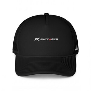 May include: A black trucker hat featuring a mesh back and a solid front panel. The front displays the white text RACK + REP with a small red cross symbol between the words. A small white logo with three vertical stripes is on the side panel.