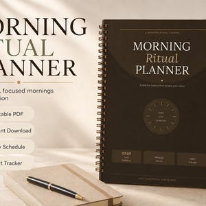 May include: A spiral-bound planner with the text "MORNING RITUAL PLANNER" in a serif font. The planner is dark brown with a clock graphic and the words "Build the habits that shape your days." Also shown are a notebook, pen, and a cup of coffee.
