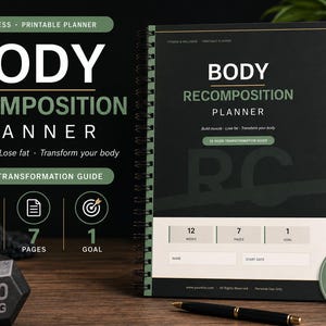 May include: A fitness planner with the title "BODY RECOMPOSITION PLANNER" is displayed. The planner is black and green and includes a 12-week transformation guide. A dumbbell weighing 10 kg is in the foreground, and a water bottle is in the background.