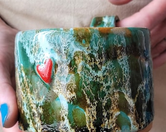 Harlequin hand thrown cup