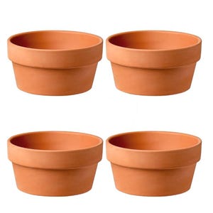 May include: A set of four terracotta plant pots arranged in a two-by-two grid. Each pot features a wide, circular opening, a thick, flat rim, and a tapered body with a smooth, matte, orange-brown finish, consistent with standard clay material.