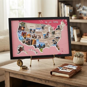 May include: A framed map of the United States with a pink background and black frame, featuring cutouts for each state filled with personal photographs. The text The Joh Family is printed in white script at the top right of the map display.