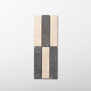 May include: A rectangular arrangement of six vertical stone tiles, featuring three light beige textured tiles and three dark charcoal gray tiles. The tiles are positioned in two rows of three, alternating colors to create a striped pattern.