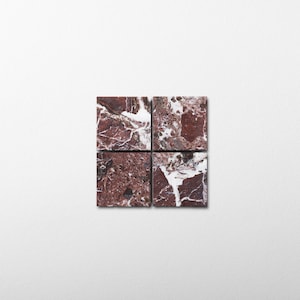 May include: Four square tiles arranged in a grid, each featuring a deep red marble surface with prominent white veining. The natural stone pattern displays a complex mix of dark burgundy, maroon, and bright white streaks across the polished surfaces.