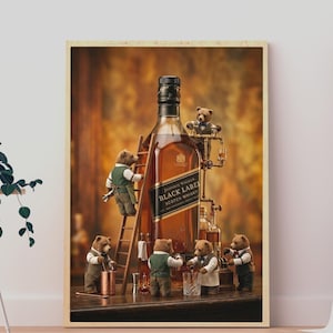 May include: A framed wall art print featuring a large bottle of Johnnie Walker Black Label Scotch Whisky surrounded by five small anthropomorphic bears wearing vests and bow ties, with one bear climbing a wooden ladder against the bottle.
