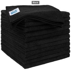 May include: A stack of solid black microfibre cleaning cloths with a textured surface. A white rectangular tag is attached to the top cloth, featuring the blue text "HOMEXCEL" and a small blue house icon graphic printed on the fabric label.