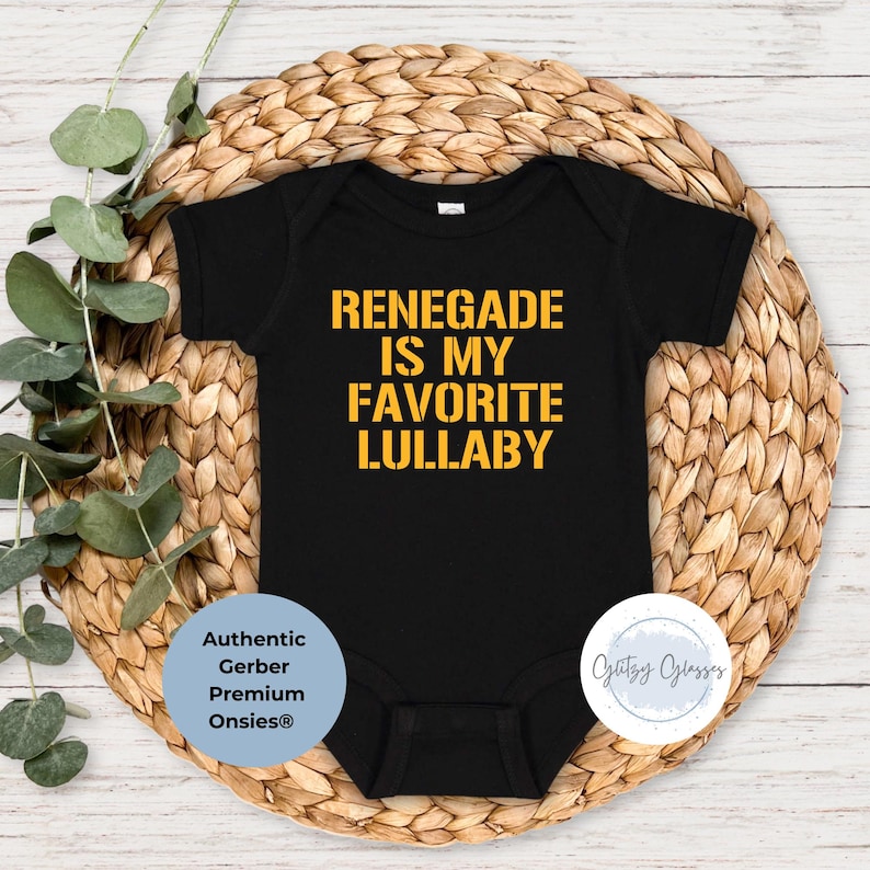 May include: Black baby grow with yellow text that reads "Renegade is my favourite lullaby".