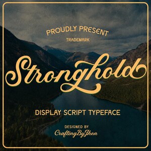 May include: A digital graphic featuring the text PROUDLY PRESENT TRADEMARK Stronghold DISPLAY SCRIPT TYPEFACE DESIGNED BY CraftingByJhon in a light yellow font over a dark mountain lake landscape framed by a thin yellow border.