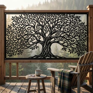 May include: A black metal privacy screen featuring a laser-cut tree design with intricate branches and leaves, mounted within a wooden frame on a deck. The screen displays a detailed silhouette of a tree against a blurred forest background.