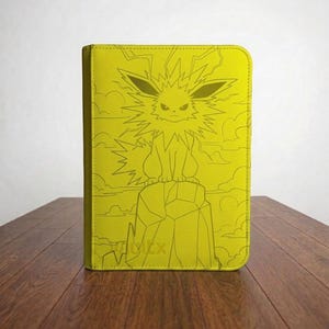 May include: A bright yellow rectangular binder featuring a monochromatic line art illustration of the creature Jolteon perched atop a jagged rock formation, surrounded by stylized clouds and lightning bolts, with a textured surface finish.