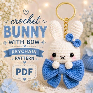 May include: A crocheted bunny keychain pattern with a blue bow and a gold-colored keyring. The bunny is white with black eyes and a blue bow on its head. The image includes the text "crochet BUNNY WITH BOW KEYCHAIN PATTERN PDF".