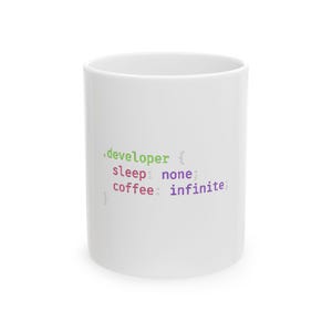 May include: White ceramic mug featuring the text ".developer { sleep: none; coffee: infinite; }" in green, purple, and pink. The mug is cylindrical and has a glossy finish. A humorous gift for programmers.