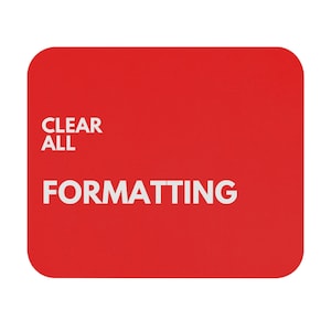 May include: A red rectangular mousepad with rounded corners. The words "CLEAR ALL" are stacked above "FORMATTING" in white, sans-serif font. The mousepad is a solid, vibrant red.
