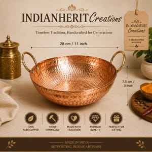 May include: A round, hammered copper bowl with two brass-colored handles. The bowl measures 11 inches in diameter and 3 inches in height. Text on the image includes INDIANHERIT Creations, Timeless Tradition, Handcrafted for Generations, and Made in India.