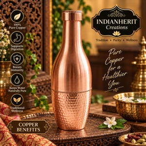 May include: A metallic copper water bottle with a smooth upper neck and a textured, hammered finish on the lower half. The bottle features a cylindrical cap and a rounded body. Text on the image includes INDIANHERIT Creations and COPPER BENEFITS.