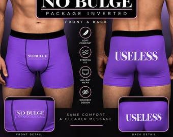 May include: Purple boxer briefs with a black waistband. The front features the text NO BULGE PACKAGE INVERTED, while the back displays the word USELESS in white lettering. The design includes icons for soft comfort, stretch fit, and discreet design.