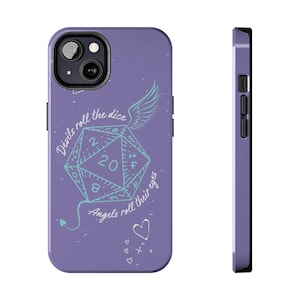 May include: A purple phone case featuring a light blue twenty-sided die graphic with a wing and a devil tail. The text reads "Devils roll the dice" and "Angels roll their eyes" in white script, accompanied by small heart and cross symbols.