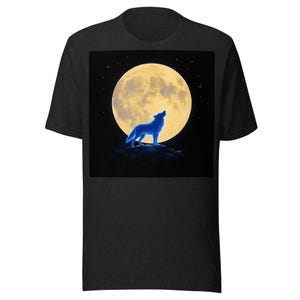 May include: A charcoal gray short-sleeve t-shirt featuring a centered graphic print of a glowing blue wolf standing on a dark rocky outcrop, silhouetted against a large, bright yellow full moon set against a deep black night sky with small stars.