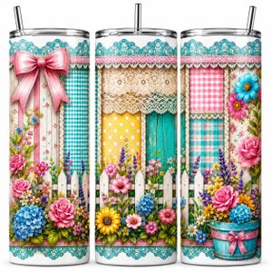 May include: A cylindrical tumbler with a metal straw featuring a wrap-around print of a white picket fence, colorful flowers, lace trim, gingham patterns, and a large pink bow. The design includes roses, sunflowers, and hydrangeas in a garden.