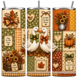 May include: A cylindrical tumbler with a straw featuring a patchwork design of autumn themes including white geese with bows, sunflowers, pumpkins, hearts, and lace trim. Text includes "Enjoy the little things," "Grateful Thankful Blessed," "Hello Autumn," and "Fall is my favorite color."