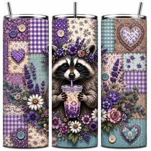 May include: A cylindrical tumbler with a straw featuring a patchwork design of purple and blue gingham, floral patterns, and lace. The design includes a raccoon wearing a flower crown and holding a purple iced drink, accented by buttons.