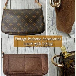 May include: A brown felt bag organizer insert featuring a gold-toned D-ring, designed for a monogrammed pochette accessory. The insert has a rectangular shape with stitched compartments. Text on the image reads: Vintage Pochette Accessories Insert with D-Ring bag not included.