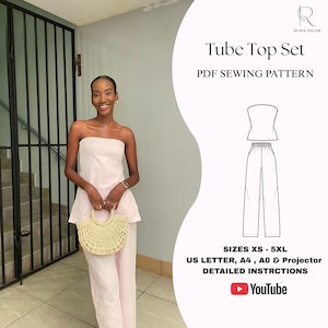 Pode incluir: Um conjunto rosa claro composto por um top sem alças e calças largas. A imagem inclui o texto: Tube Top Set, PDF SEWING PATTERN, SIZES XS - 5XL, US LETTER, A4, A0 & PROJECTOR, DETAILED INSTRCTIONS e um ícone do YouTube. Um desenho linear mostra a peça.