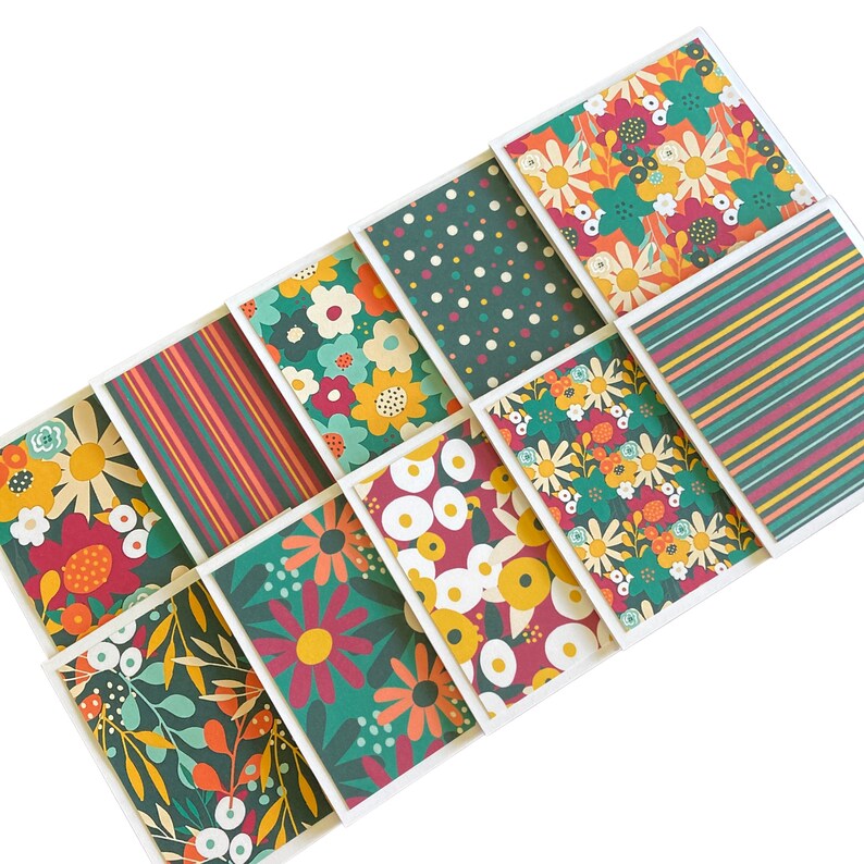 May include: Nine different patterned cards with a variety of floral and geometric designs in shades of green, yellow, red, and white.