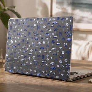 May include: A dark gray laptop cover featuring a repeating pattern of blue and white surf-themed icons including palm trees, surfboards, sea turtles, flip-flops, beach umbrellas, and oval badges with the text SURF'S UP printed in blue letters.
