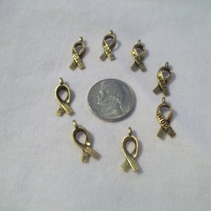 Lot of 25 Ribbon of Hope charms gold color for DIY jewelry projects Awareness ribbons