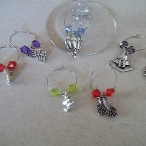 Wizard of Oz themed wine charms with colorful beads - hot air balloon witch hat broom rainbow slippers