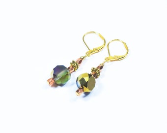 Crystal and gold, exotic lightweight earrings. Prism flashes of gold, blue, green, purple. Faceted, flat sided crystals, delicate and regal.