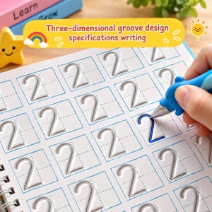 May include: A white practice workbook featuring a grid of embossed number two shapes with a three-dimensional groove design. A blue dolphin-shaped pen is tracing one of the grooves. The page includes the text Three-dimensional groove design specifications writing.