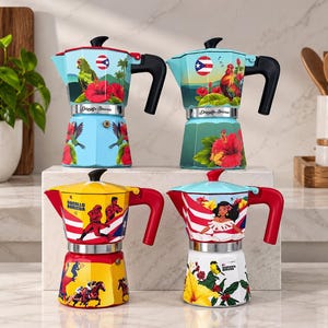 May include: Four stovetop espresso makers featuring colorful designs. The top left is light blue with a parrot and hibiscus. The top right is light blue with a rooster and hibiscus. The bottom left is yellow with baseball players. The bottom right is white with a woman and flowers.