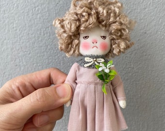 Handmade grumpy bunny doll with her flower