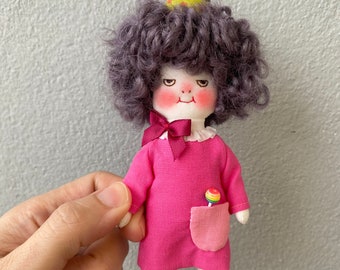 Handmade smiling doll with her pet