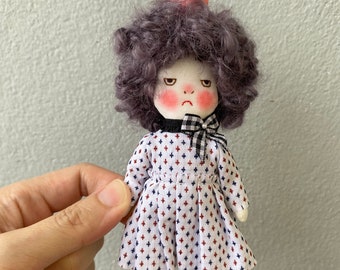 Handmade grumpy doll with her pet