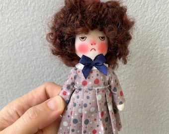 Handmade grumpy doll with her pet