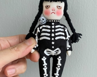 Handmade grumpy skeleton doll