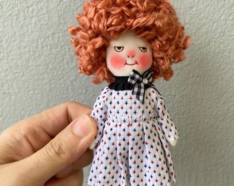 Handmade smiling doll with her pet