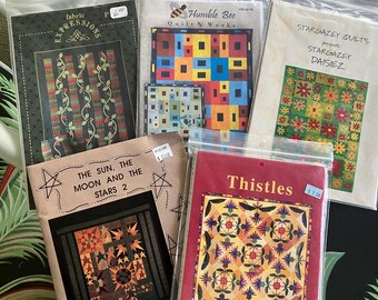 Five Quilt Patterns: Stargazey Daisiez, Hole in Wall, Sun Moon Stars, Thistles, Amish Coinflowers