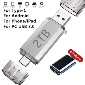 May include: A silver 2TB USB flash drive with a USB 3.0 connector and a Type-C adapter. The image includes text that says "For Type-C, For Android, For Phone/iPad, For PC USB 3.0". A gift adapter is also included.