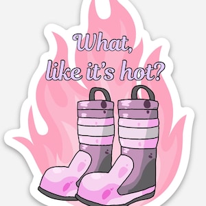 May include: A sticker featuring a pair of purple and pink boots set against a background of light pink flames. The text "What, like it's hot?" is written in a purple font above the boots. The design has a white border and a smooth finish.