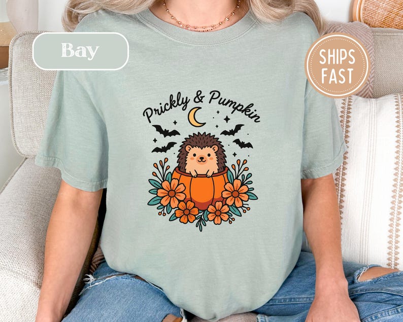 T-shirt with hedgehog in pumpkin and text "Prickly & Pumpkin", "Bay", "Ships Fast".