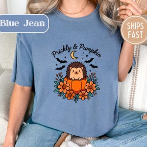 Blue t-shirt with "Prickly & Pumpkin" text and a hedgehog in a pumpkin.