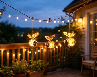 Three-piece vintage ironwork bee solar lamp. Suitable for gardens or patios. Decorative lamp. Creates an atmosphere in the yard or garden.